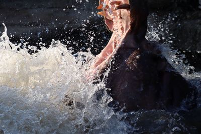 Close-up of person swimming in sea