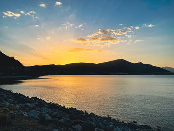 Scenic view of sea against sky during sunset