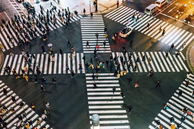 High angle view of people walking on city street