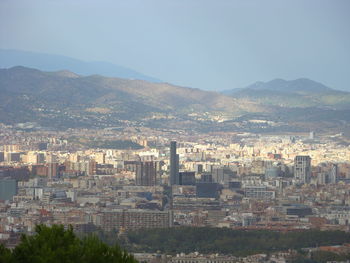High angle view of buildings in city against clear sky