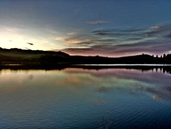 Scenic view of lake at sunset