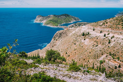 High angle view of sea shore against sky