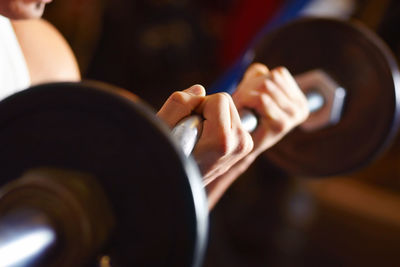 Midsection of woman exercising in gym