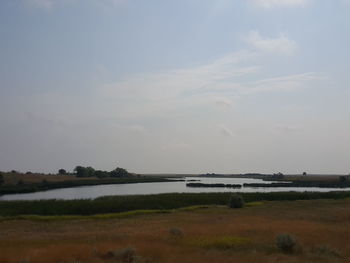 Scenic view of beach against sky