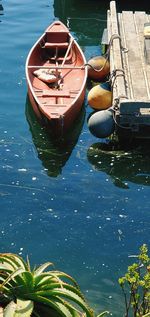 High angle view of boat moored in lake