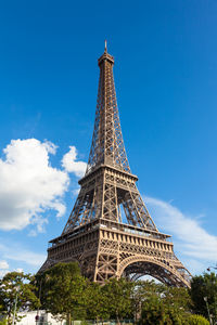 Low angle view of eiffel tower against blue sky