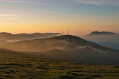 Scenic view of landscape against sky during sunset