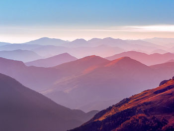 Scenic view of mountains against sky during sunset