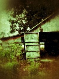 Abandoned building in field