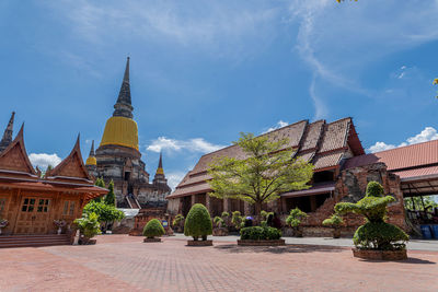 Panoramic view of temple amidst buildings against sky