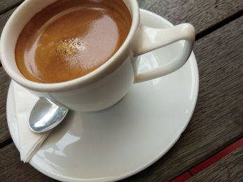 High angle view of coffee cup on table