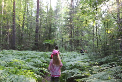 People standing in forest