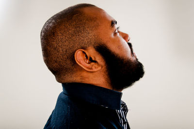 Close-up of young man against white background
