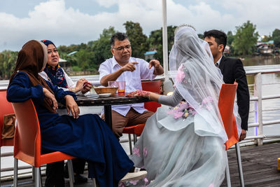 Friends sitting on table