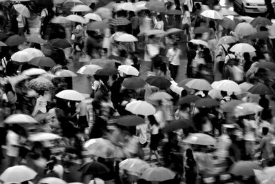 High angle view of people walking on street in city