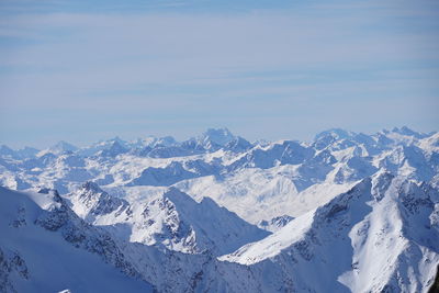 Scenic view of snowcapped mountains against sky