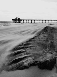 Pier over sea against sky