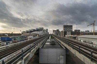 High angle view of railroad tracks against cloudy sky