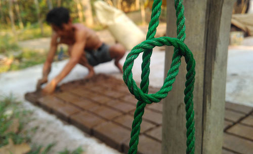 Close-up of ropes hanging on rope