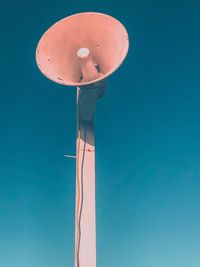 Low angle view of balloons against blue sky