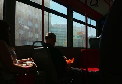 Close-up of man sitting in train