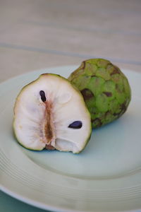 Close-up of fruit in plate on table