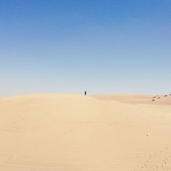 Scenic view of desert against clear sky