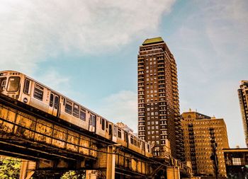 Low angle view of skyscrapers against sky