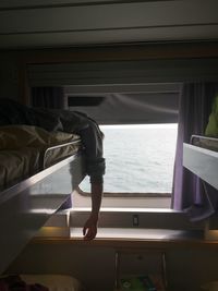 Low section of man in berth on ferry