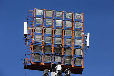Low angle view of building against clear blue sky