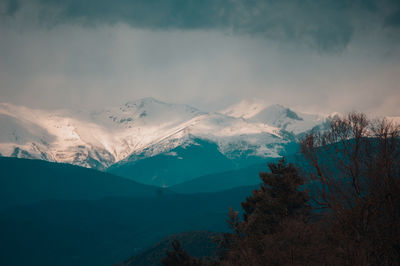 Scenic view of mountains against sky during winter