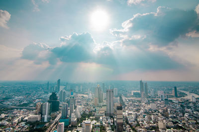 Aerial view of modern buildings in city against sky