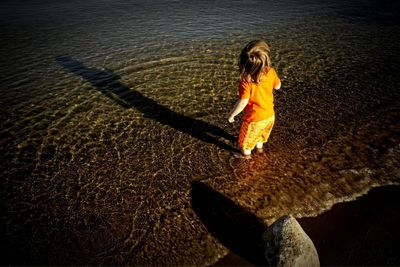 Reflection of woman in water