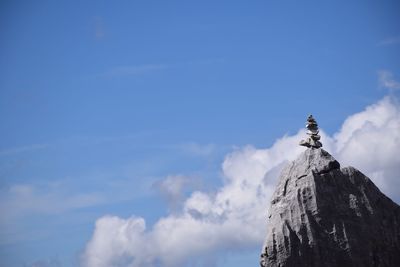 Low angle view of statue against blue sky