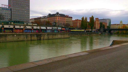 River in city against sky