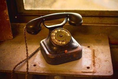 High angle view of telephone on table