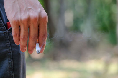 Close-up of hand against blurred background