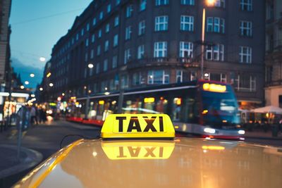 Close-up of taxi in city at night