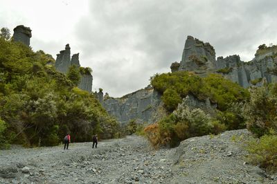 Scenic view of mountains against cloudy sky