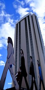 Low angle view of women against sky