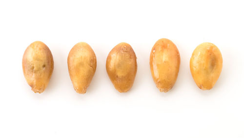 Close-up of macaroons against white background