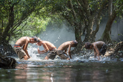 People swimming in lake