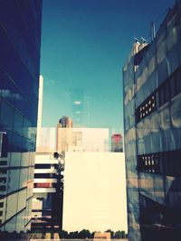 Low angle view of buildings against blue sky