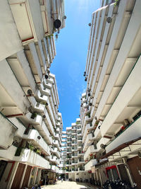 Low angle view of buildings in city against sky