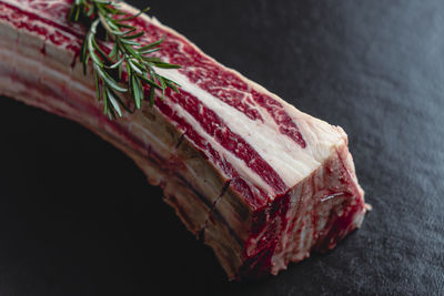 High angle view of bread on table against black background