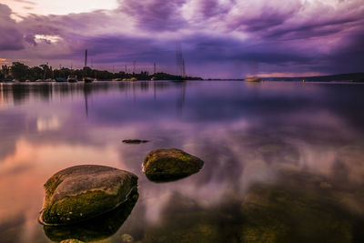 Scenic view of lake against sky during sunset