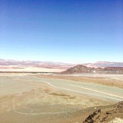 View of desert against blue sky