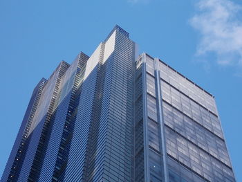 Low angle view of modern building against clear blue sky