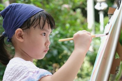 Side view of boy holding ice cream