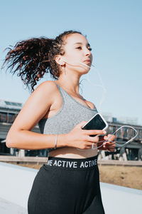 Young woman using mobile phone